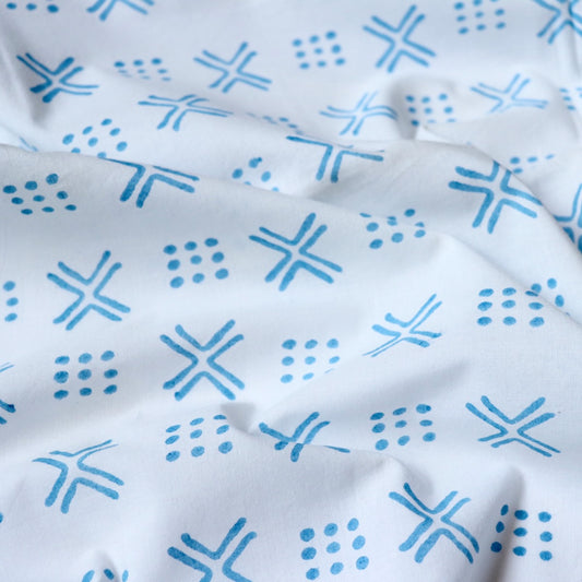 x and dots blue printed cotton fabric
