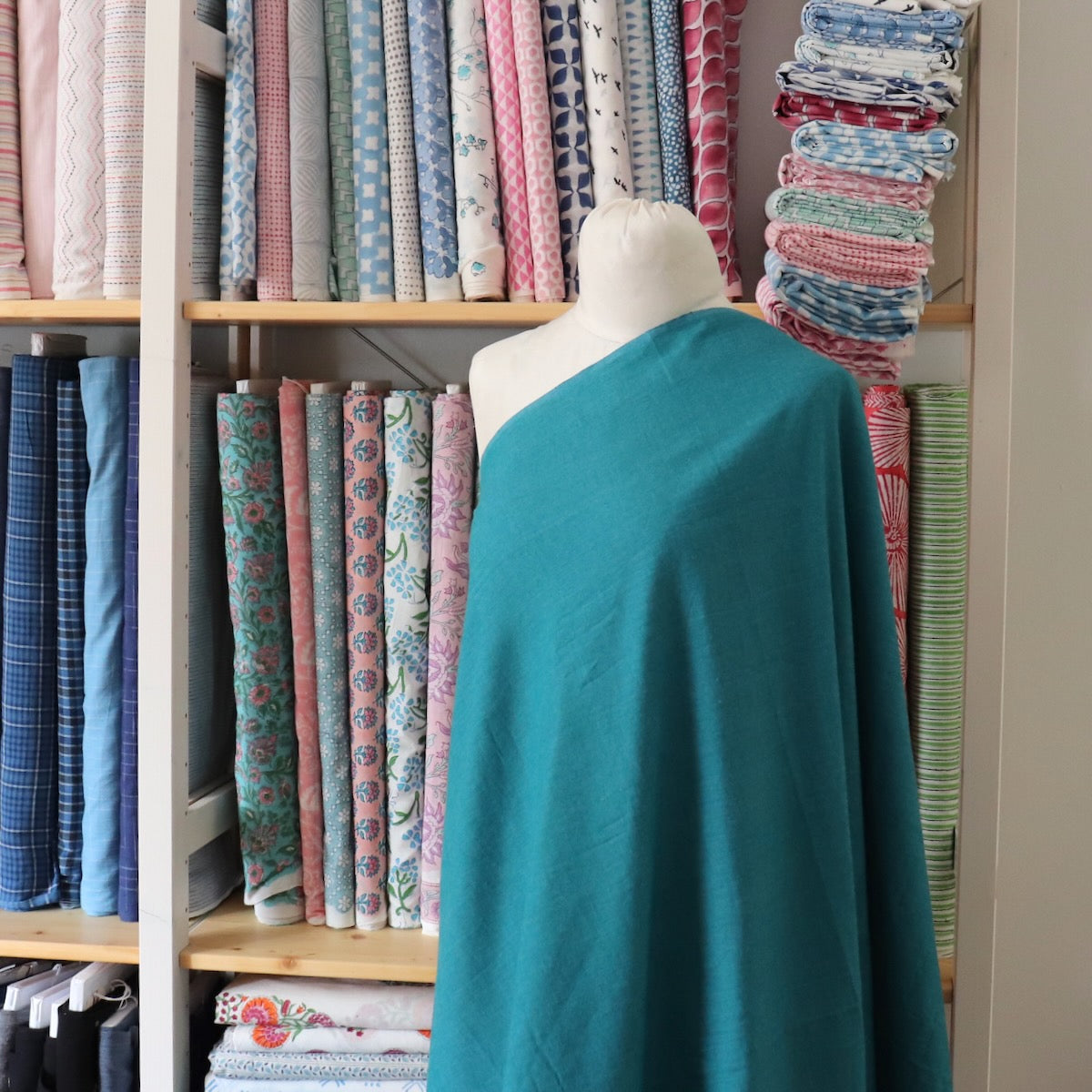 dark turquoise peppered cotton quilting fabric by the yard