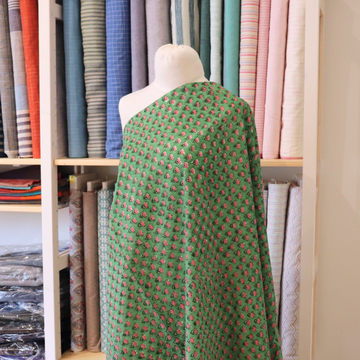 tiny pink floral hand block print fabric on bright green cotton