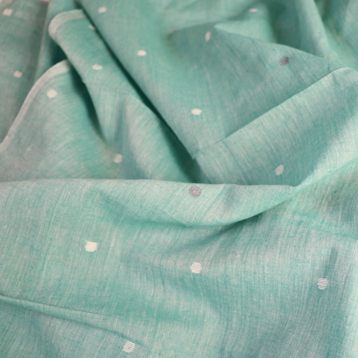 green jamdani cotton shot handloom fabric with white dots