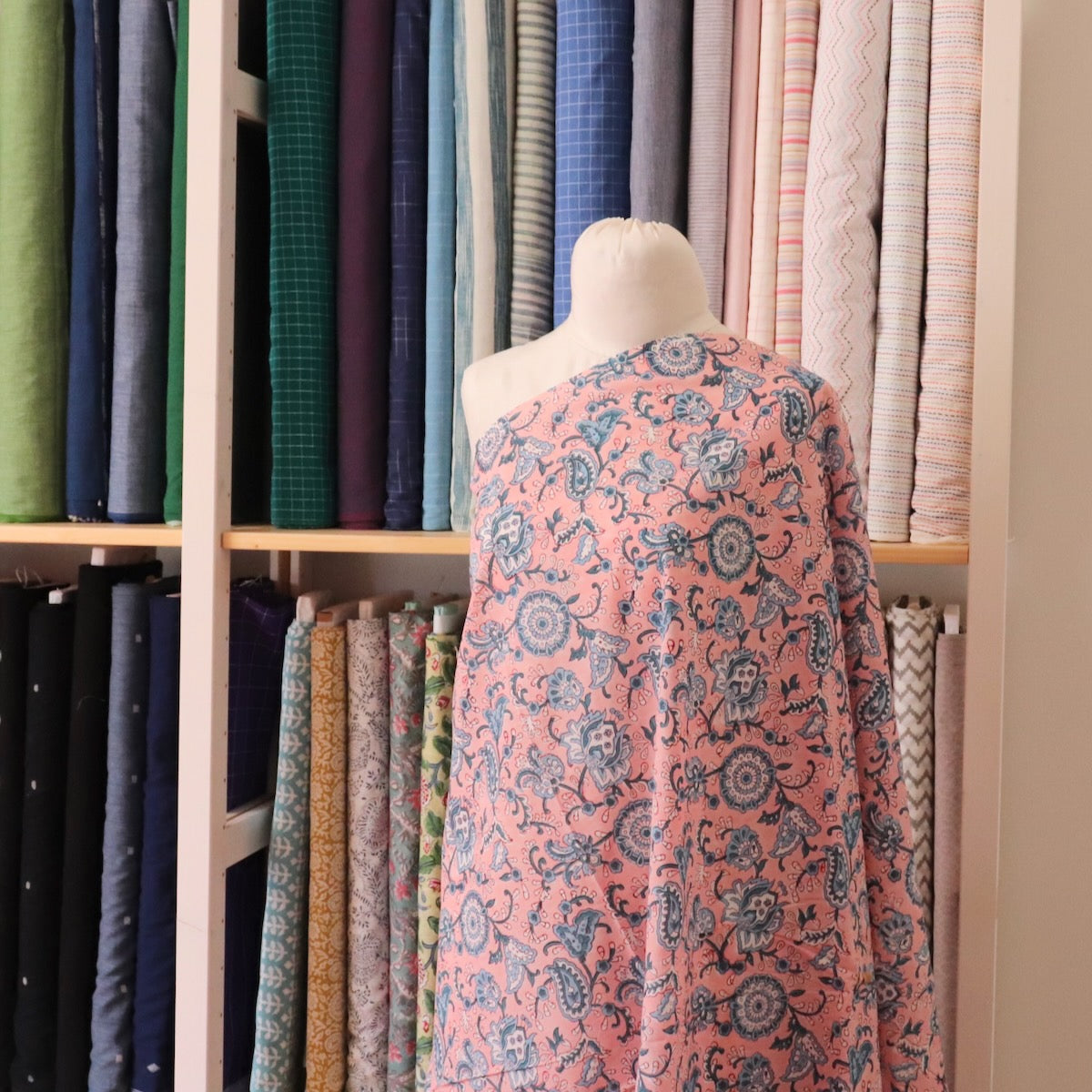 bright pink hand block print fabric with blue paisley design indian cotton