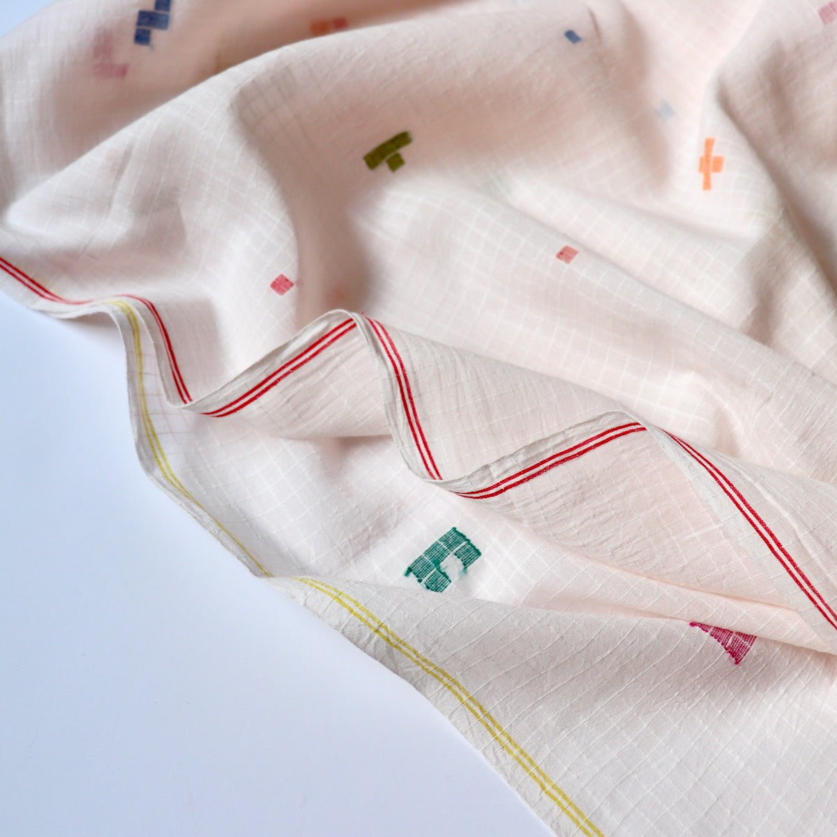 pink jamdani cotton fabric with colorful geometric weave
