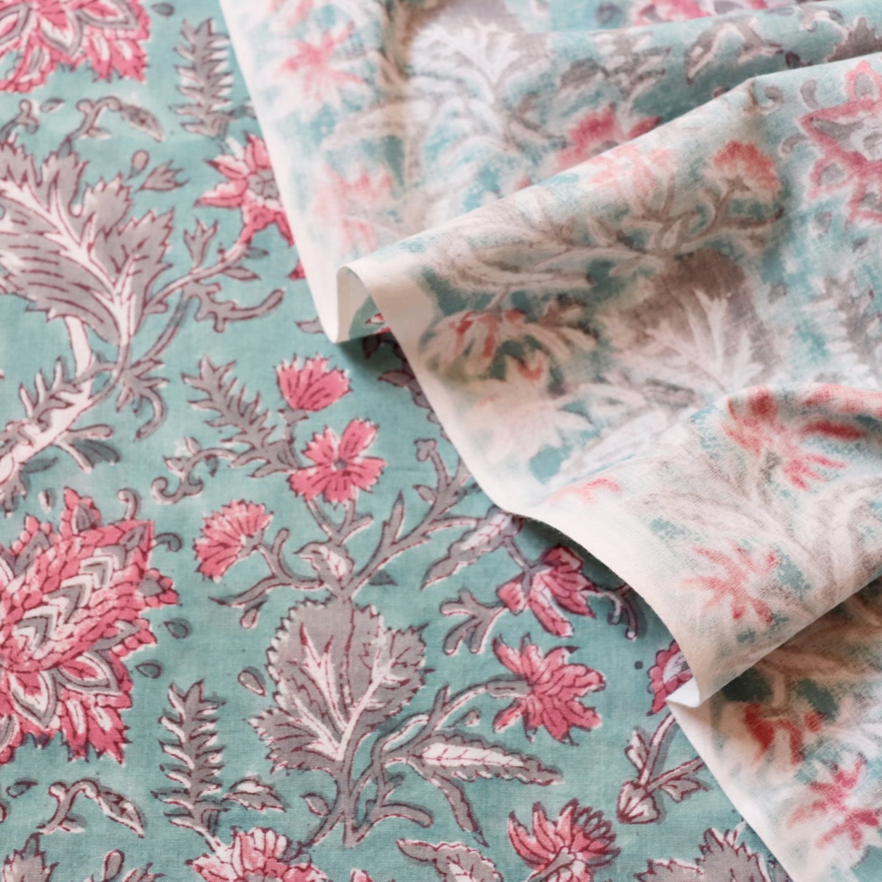 aqua blue hand block print fabric with pink flowers