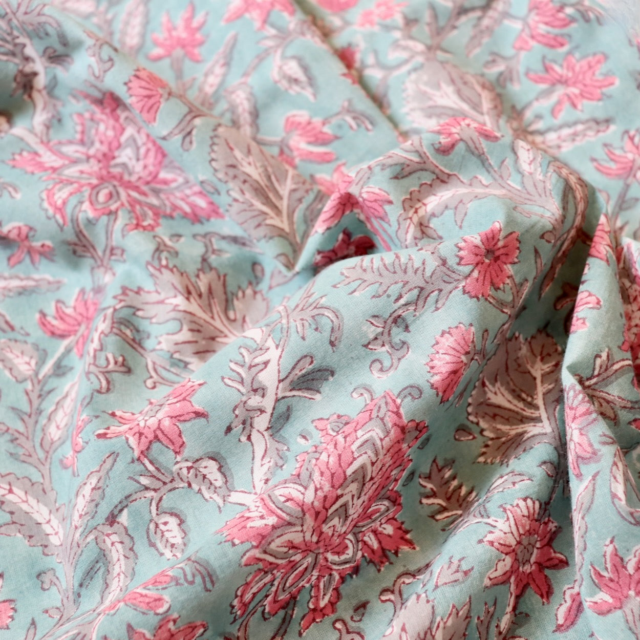 aqua blue hand block print fabric with pink flowers