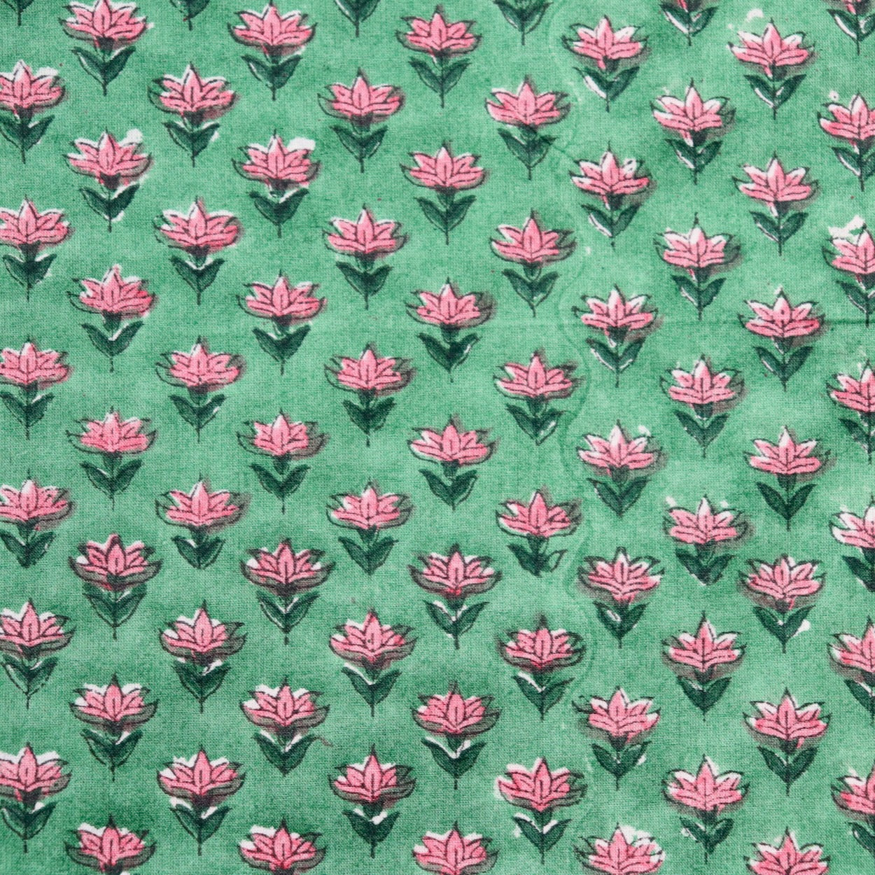 tiny pink floral hand block print fabric on bright green cotton