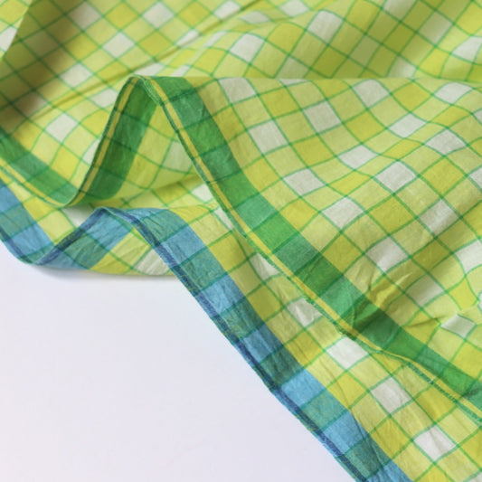 yellow checked cotton fabric with blue and green selvages
