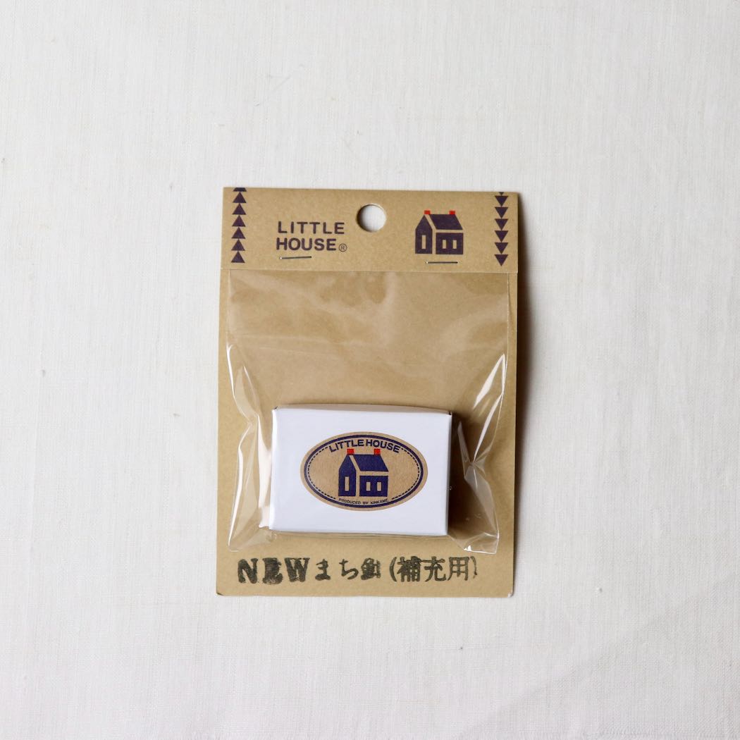 little house dressmakers pin in paper box