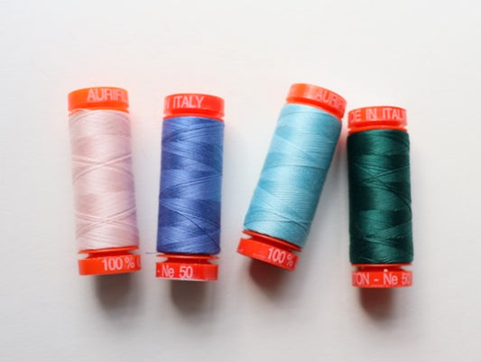 try using cotton thread when sewing natural fiber fabrics