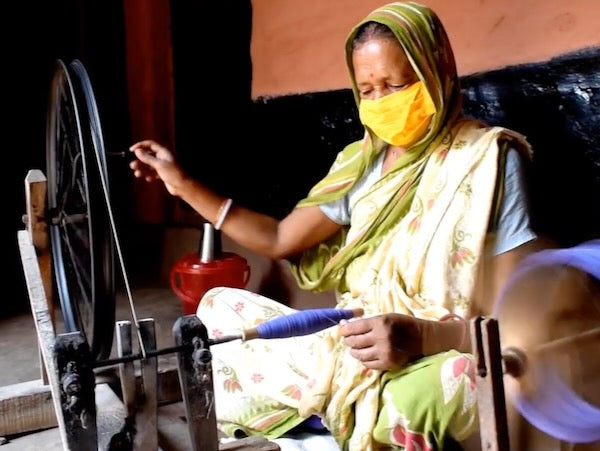 many hand are involved in traditional Indian handloom fabric production 