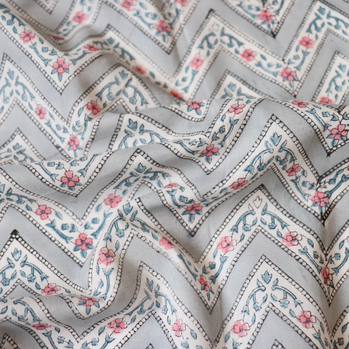 gray and white Zig-zag striped cotton fabric with pink flowers made in Jaipur