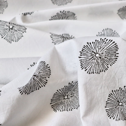white cotton fabric with hand printed black flowers made in India