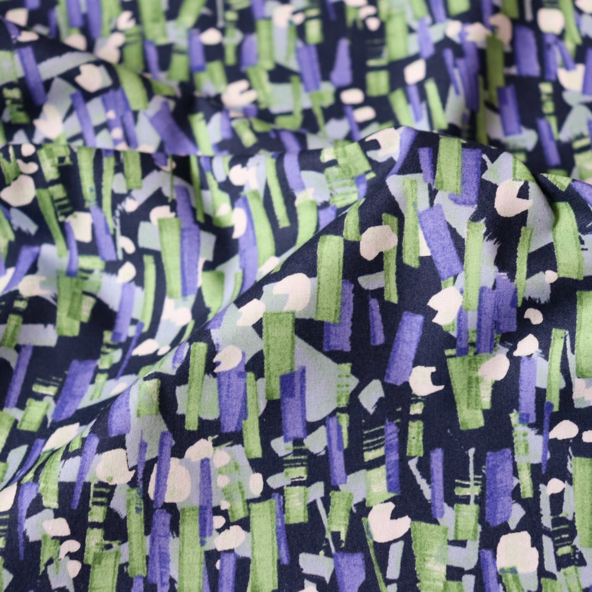 Japanese cotton fabric with colorful dashed lines on dark blue background