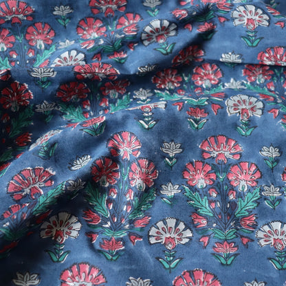 dark blue block printed cotton fabric with red flowers for quilting and dressmaking