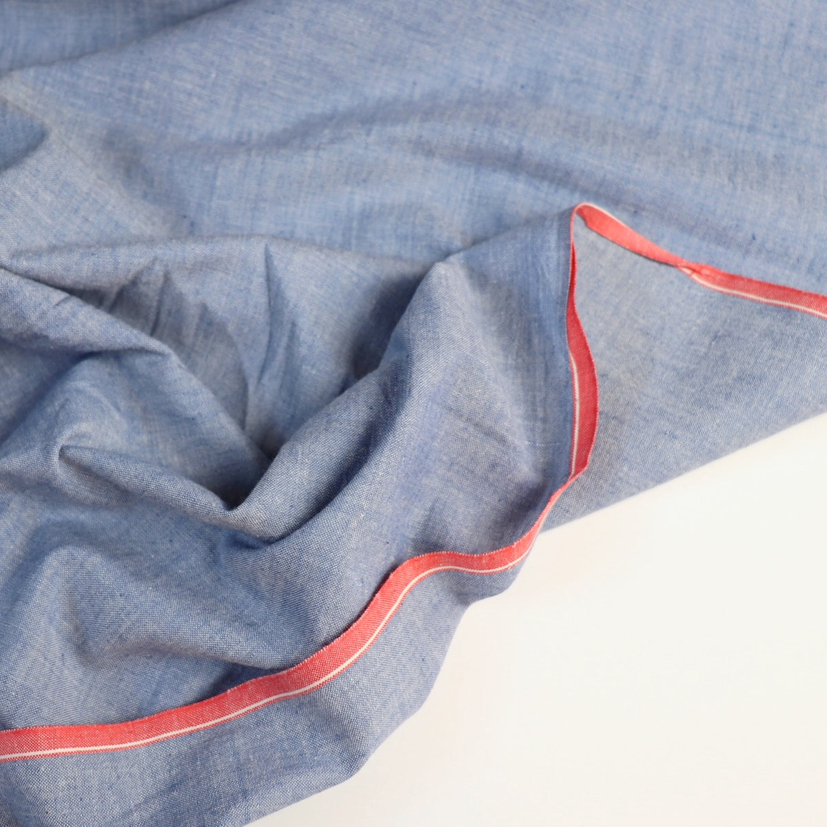 blue cotton chambray fabric handwoven shirting with red selvages