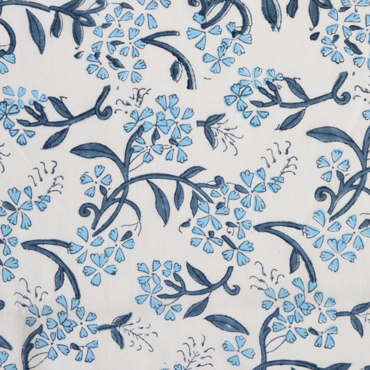blue and white delicate floral hand block print white cotton dressmaking and quilting fabric