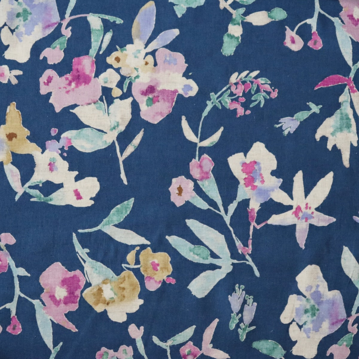blue linen cotton fabric from Japan with colorful watercolor-style floral print 