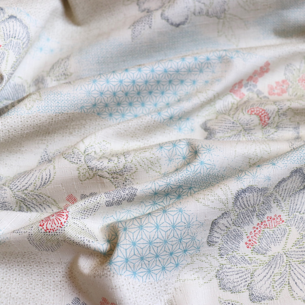 cotton dobby fabric textured weave from Japan light gray with traditional stencilled floral design