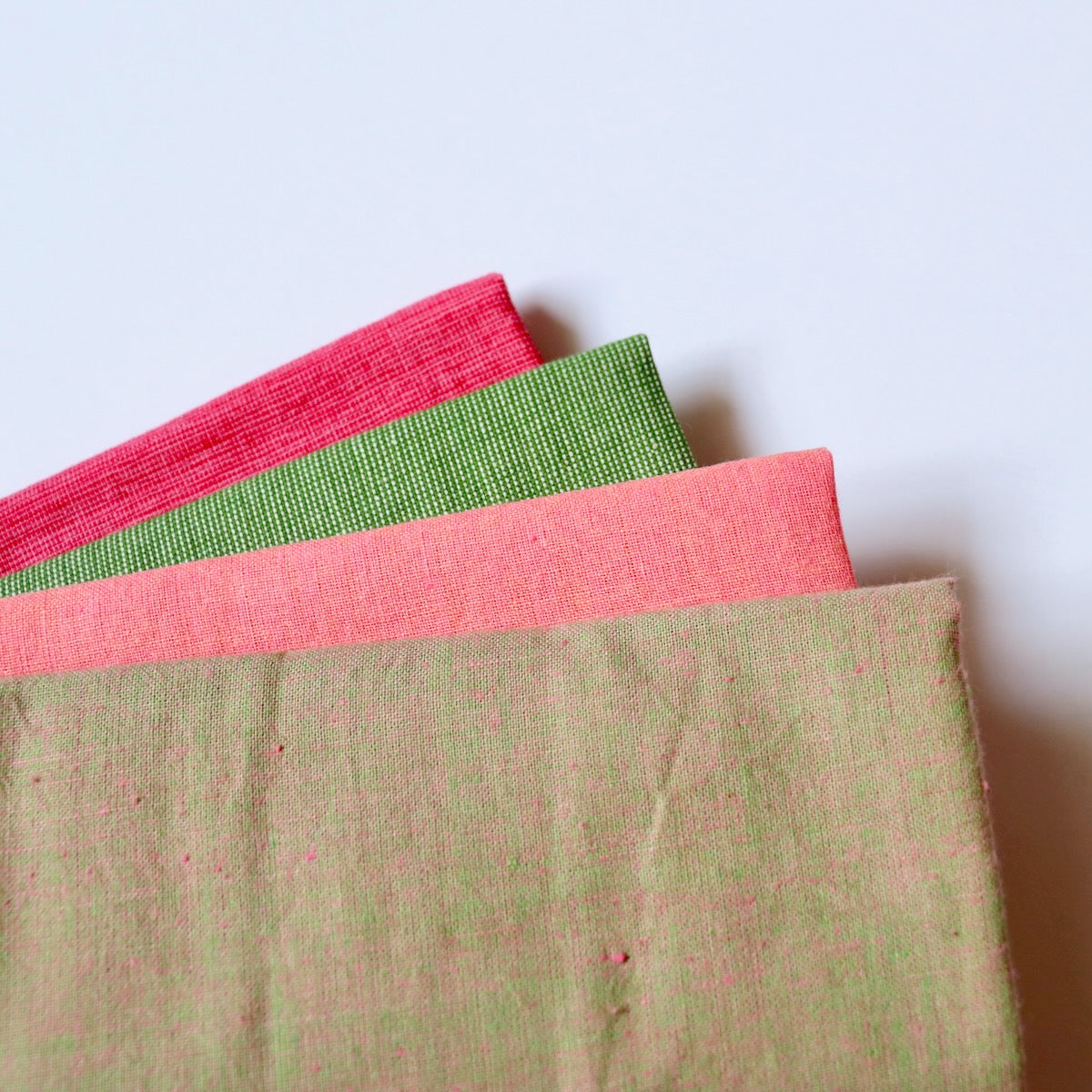 fat quarter bundle shot cottons and textured fabric pink and green