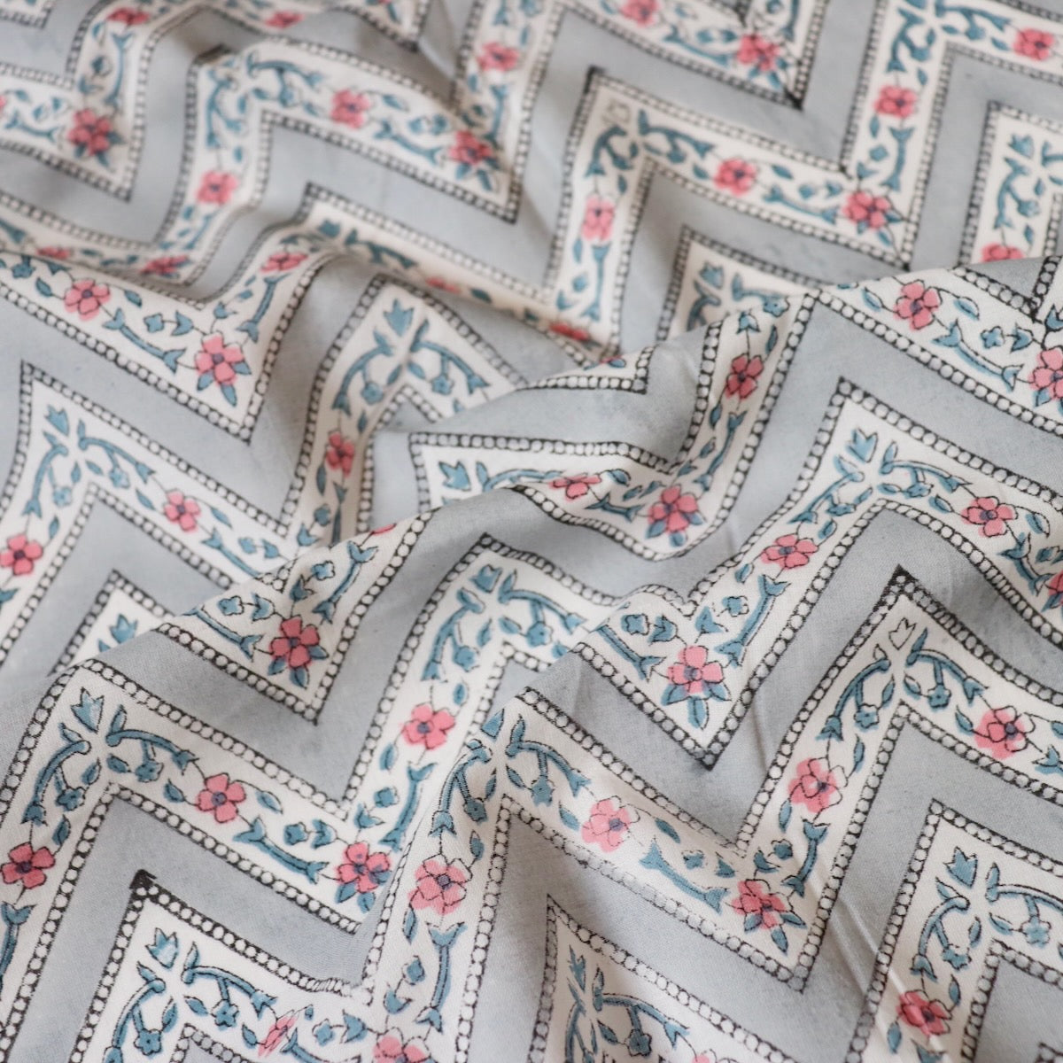 gray and white Zig-zag striped cotton fabric with pink flowers made in Jaipur