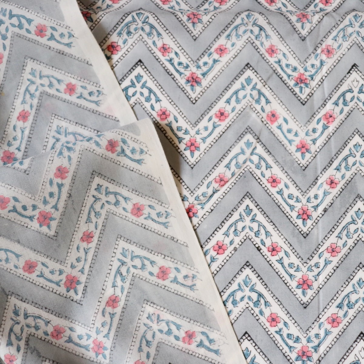 gray and white Zig-zag striped cotton fabric with pink flowers made in Jaipur