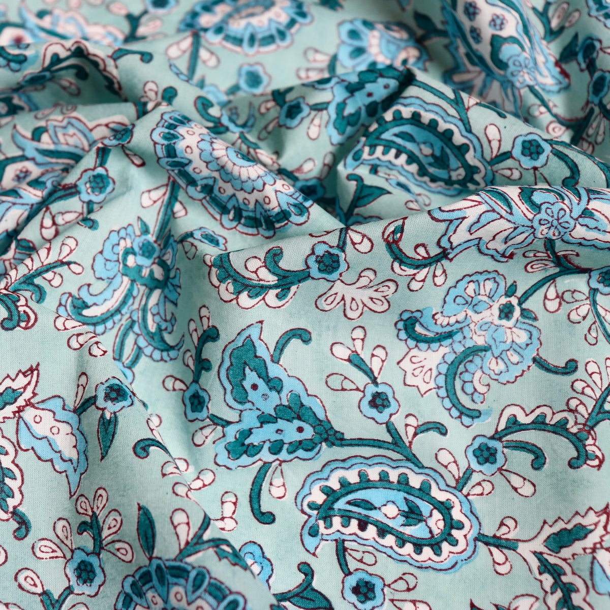 light blue paisley print fabric with turquoise flowers hand made in India