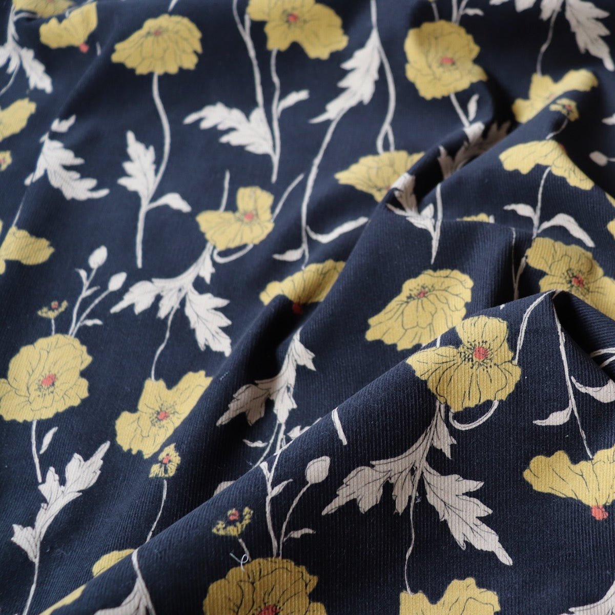 hokkoh poppies fabric cotton pinwale cord black and yellow floral 