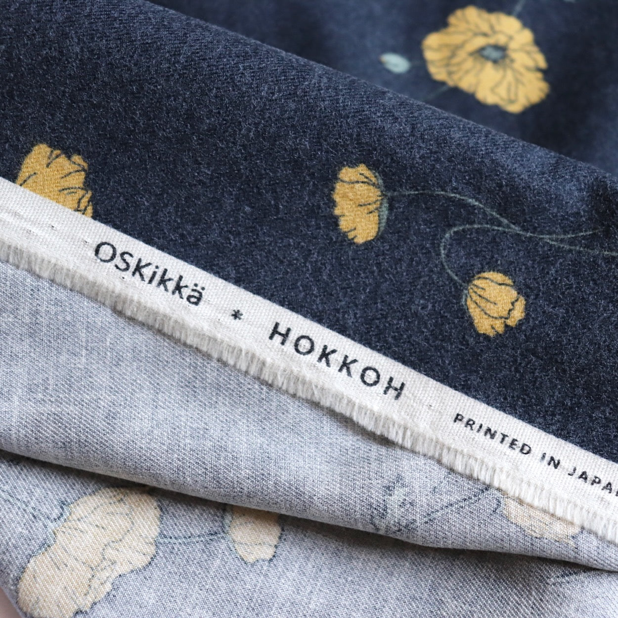 hokkoh poppy print fabric from japan brushed cotton flannel charcoal gray and yellow floral print