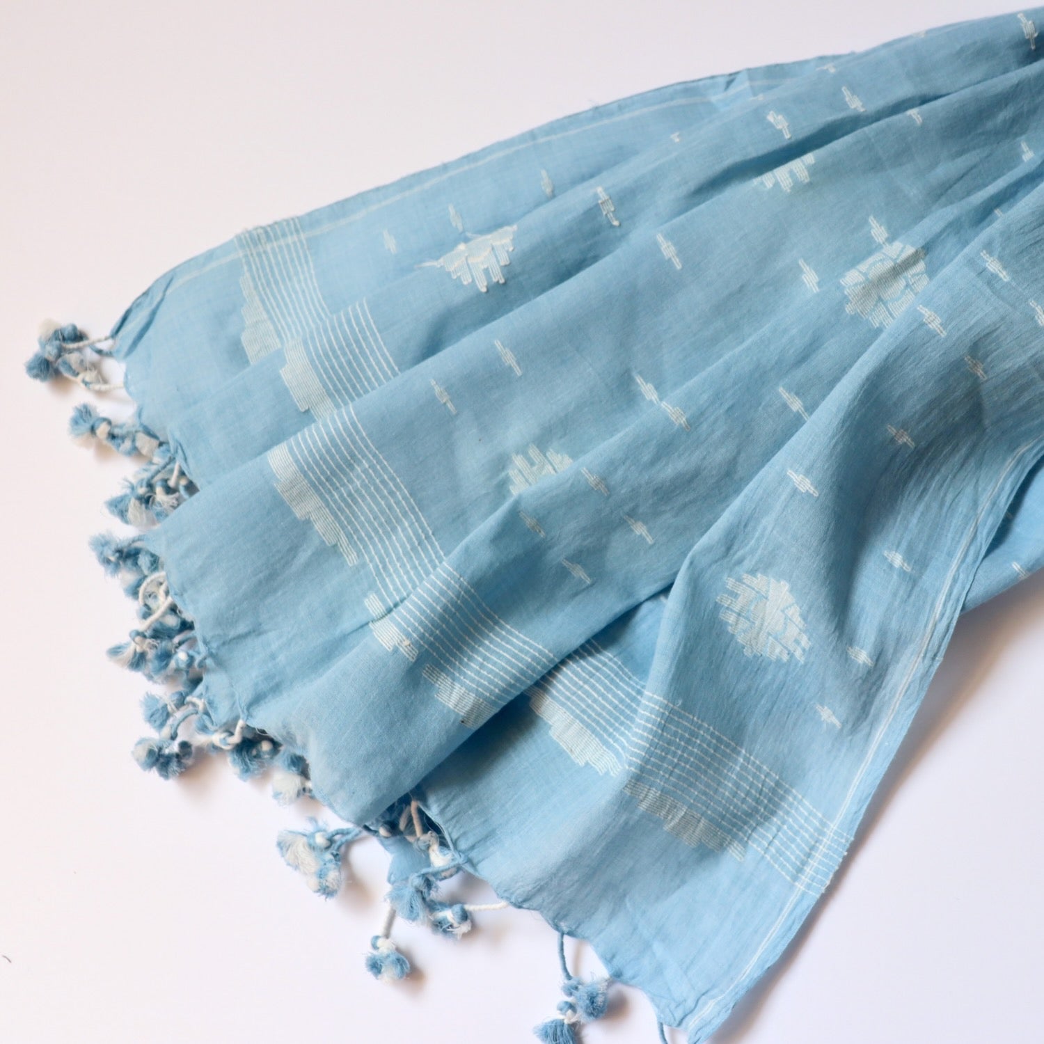 sky blue indigo jamdani weave cotton scarf with white floral design