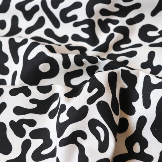 large abstract black and white keith haring-style cotton fabric