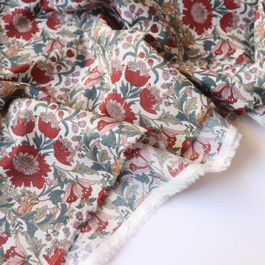 red and white woodland floral print cotton lawn fabric with squirrels