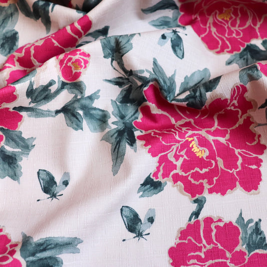 large peony blossoms on pale pink textured cotton dobby fabric from Japan