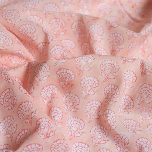 light pink block printed cotton fabric with small white floral print very soft fabric for sewing and historical dressmaking