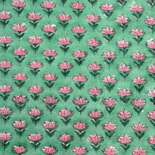 tiny pink floral hand block print fabric on bright green cotton 