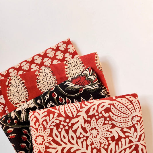 red and black fat quarter bundle soft cotton fabrics hand printed floral designs for quilting and crafts
