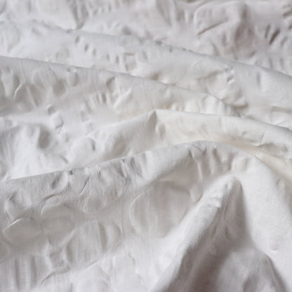 white linen cotton seersucker fabric with floral design