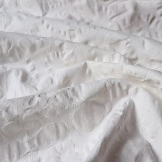 white linen cotton seersucker fabric with floral design