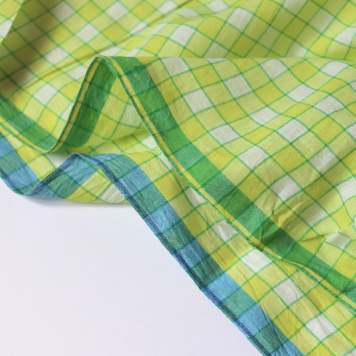 yellow checked cotton fabric with blue and green selvages