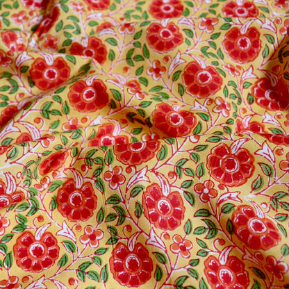 bright yellow and red floral design hand printed cotton fabric made in India