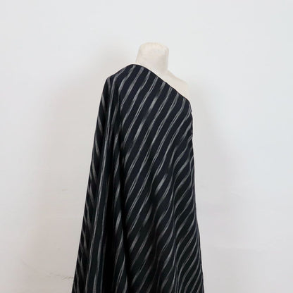 black ikat dyed horizontal stripe shirtmaking fabric