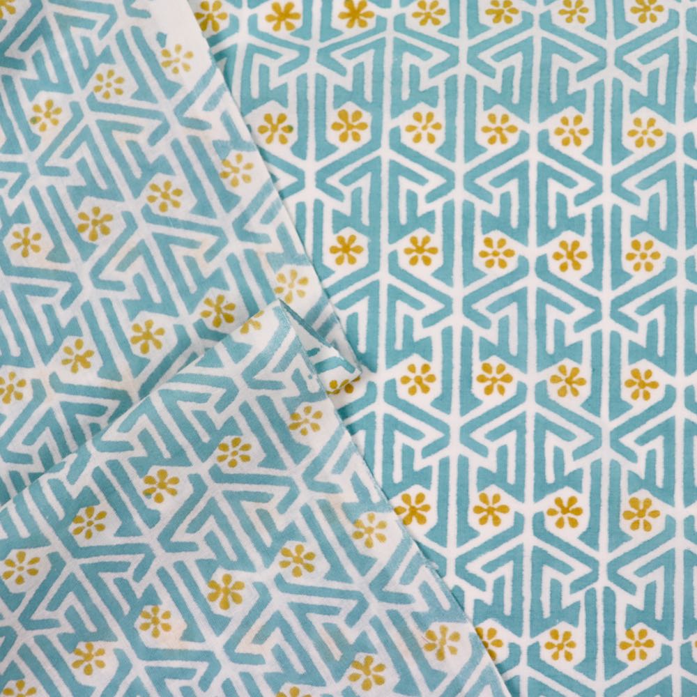 blue and yellow flower maze block printed cotton fabric