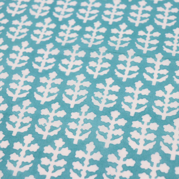 turquoise and white sprigs block printed cotton fabric