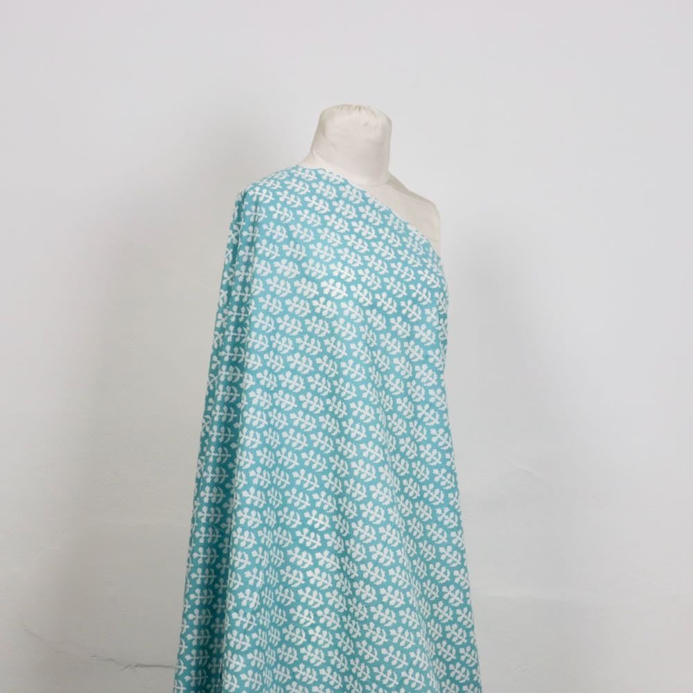 turquoise and white sprigs block printed cotton fabric