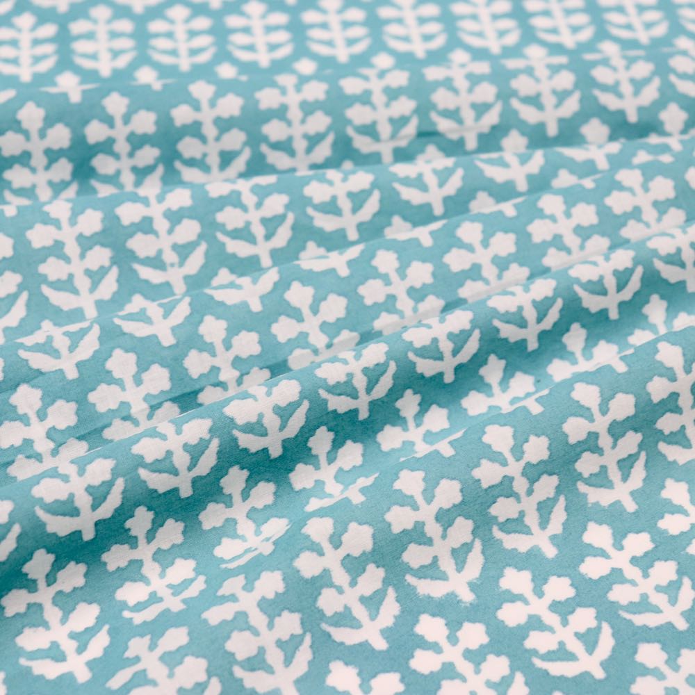 turquoise and white sprigs block printed cotton fabric