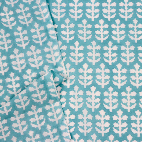 turquoise and white sprigs block printed cotton fabric
