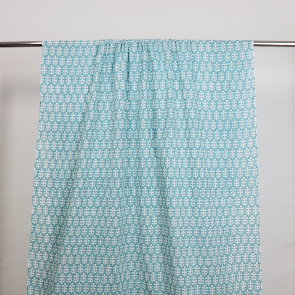 turquoise and white sprigs block printed cotton fabric